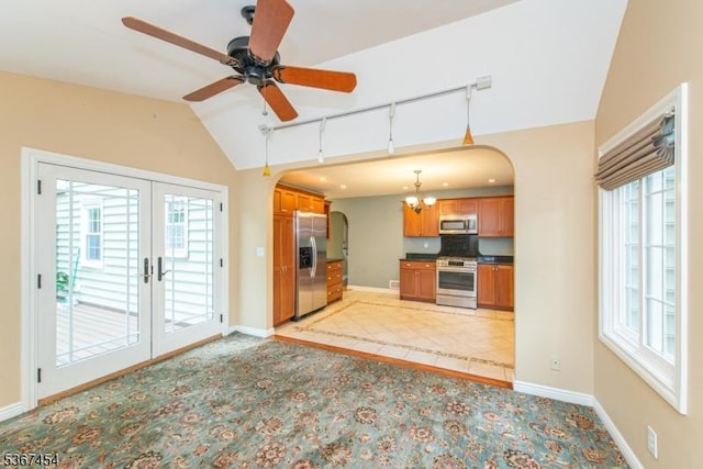 88 Overlook Ave, East Hanover Twp, NJ 07936 - kitchen featuring stainless steel appliances, arched walkways, vaulted ceiling, brown cabinets, and french doors