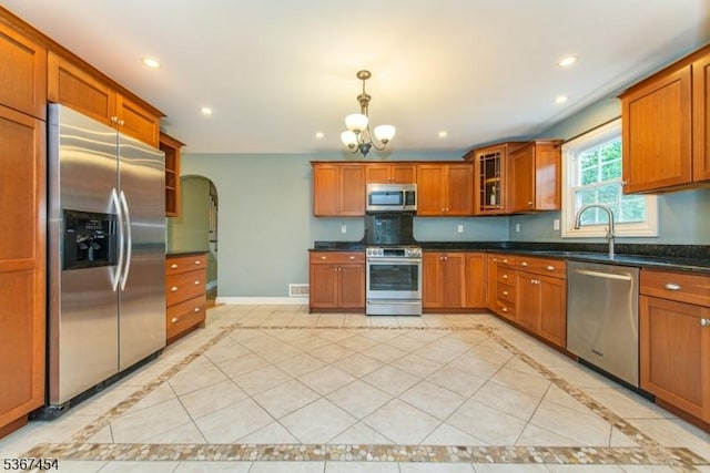 88 Overlook Ave, East Hanover Twp, NJ 07936 - kitchen featuring appliances with stainless steel finishes, inlaid floor details, a chandelier, brown cabinets, and recessed lighting