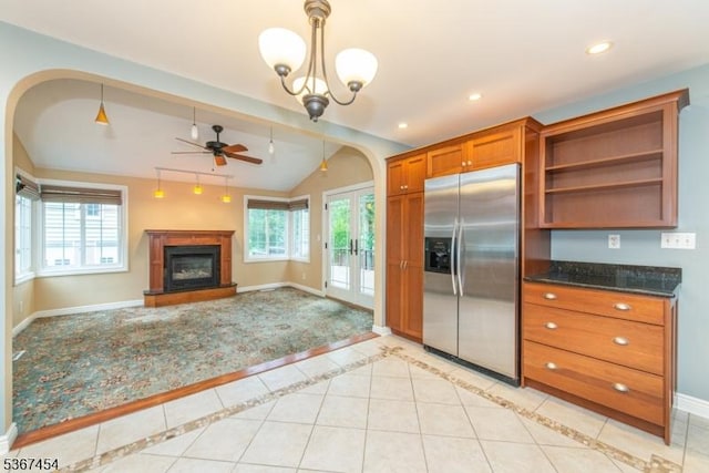 88 Overlook Ave, East Hanover Twp, NJ 07936 - kitchen with stainless steel fridge with ice dispenser, lofted ceiling, brown cabinets, a glass covered fireplace, and arched walkways