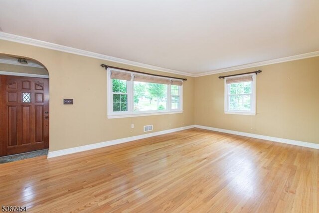 88 Overlook Ave, East Hanover Twp, NJ 07936 - empty room with arched walkways, light wood-style floors, and crown molding