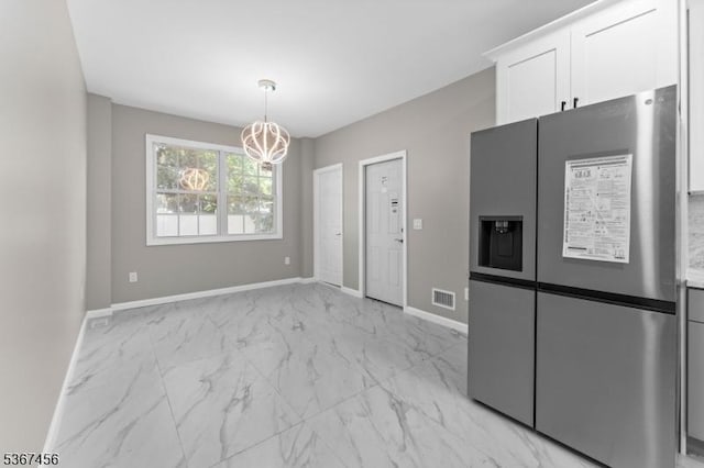 331 W Ln, Clark Twp, NJ 07066 - kitchen with stainless steel fridge, a chandelier, light marble finish floors, white cabinets, and decorative light fixtures