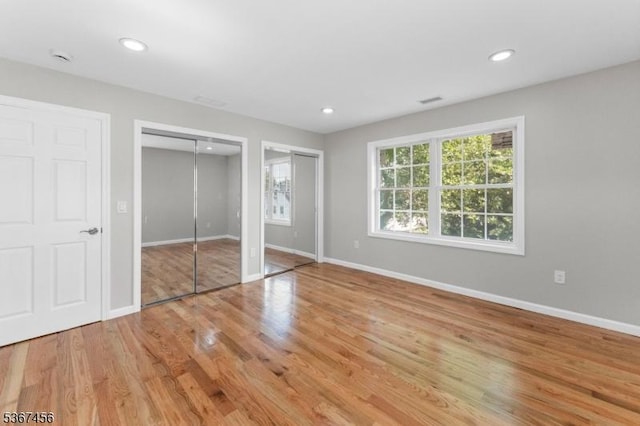 331 W Ln, Clark Twp, NJ 07066 - unfurnished bedroom featuring multiple closets, wood finished floors, and recessed lighting