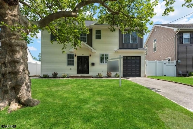 331 W Ln, Clark Twp, NJ 07066 - view of front of property with an attached garage, concrete driveway, and a gate