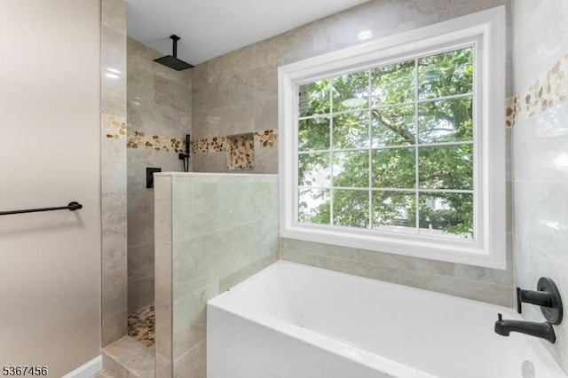 331 W Ln, Clark Twp, NJ 07066 - bathroom featuring a garden tub, a walk in shower, and plenty of natural light
