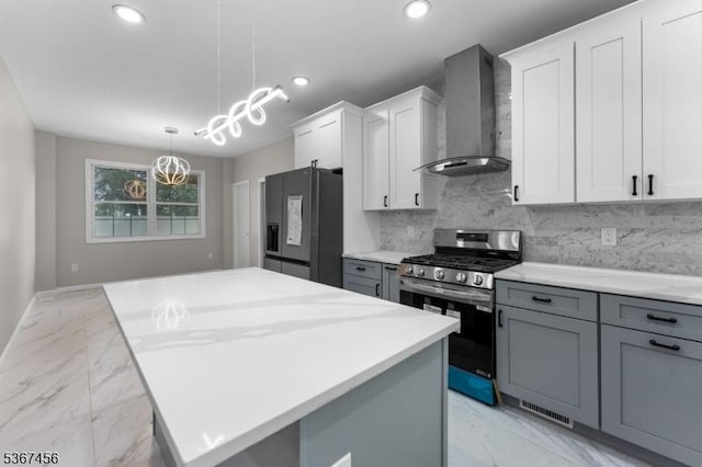 331 W Ln, Clark Twp, NJ 07066 - kitchen with wall chimney exhaust hood, stainless steel range with gas stovetop, black refrigerator with ice dispenser, light marble finish floors, and decorative backsplash