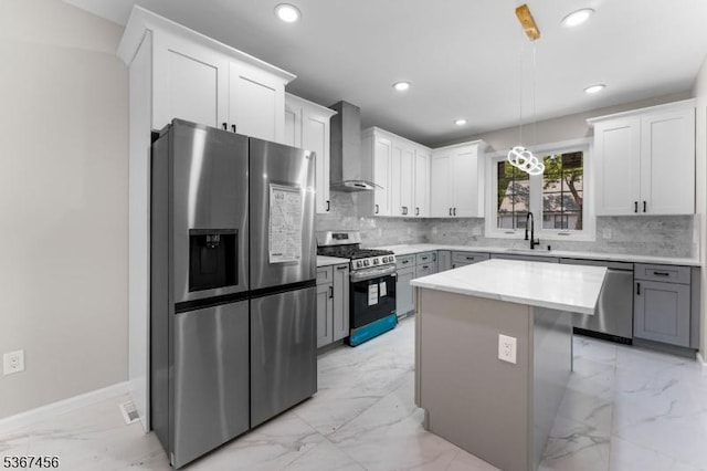 331 W Ln, Clark Twp, NJ 07066 - kitchen featuring stainless steel appliances, wall chimney exhaust hood, light marble finish floors, tasteful backsplash, and recessed lighting