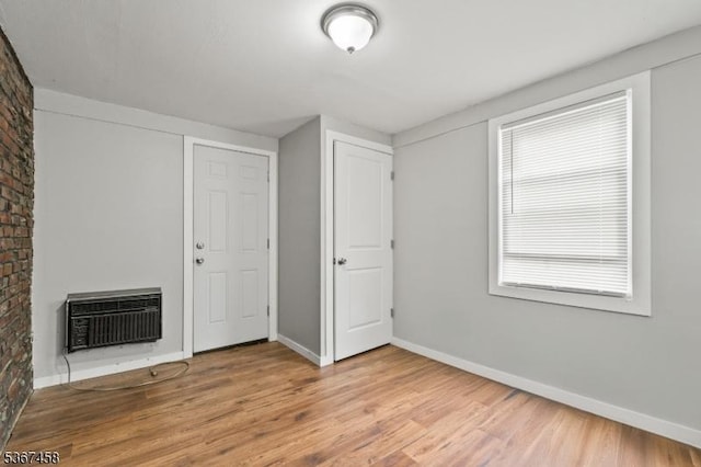 917 Tompkins Ave, South Plainfield Boro, NJ 07080 - spare room with wood finished floors, heating unit, and a fireplace