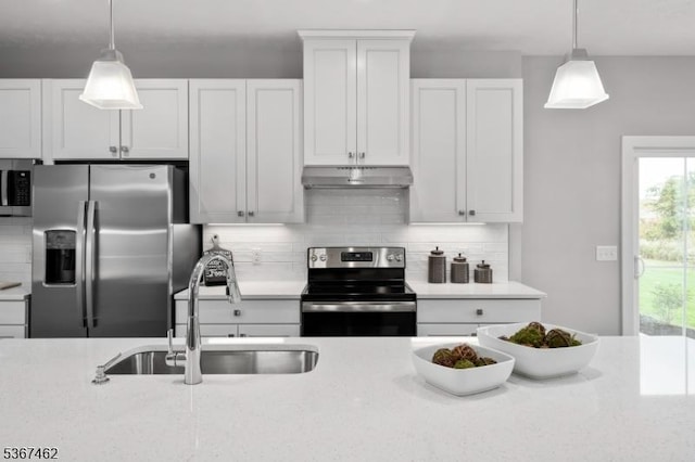 7 Glacier Way, Union Twp, NJ 08867 - kitchen with stainless steel appliances, under cabinet range hood, decorative backsplash, decorative light fixtures, and white cabinets