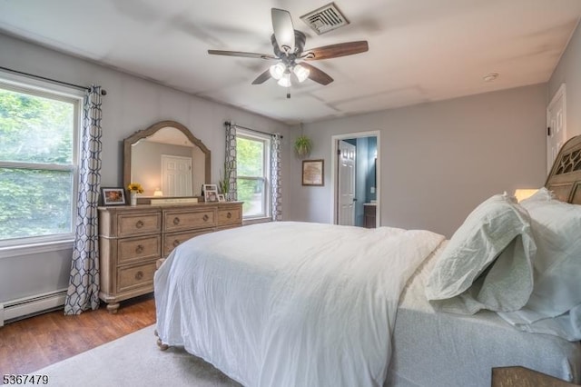 37 Evergreen Rd, Vernon Twp, NJ 07461 - bedroom featuring baseboard heating, wood finished floors, and ceiling fan