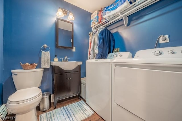 37 Evergreen Rd, Vernon Twp, NJ 07461 - half bath featuring independent washer and dryer, vanity, and wood finished floors
