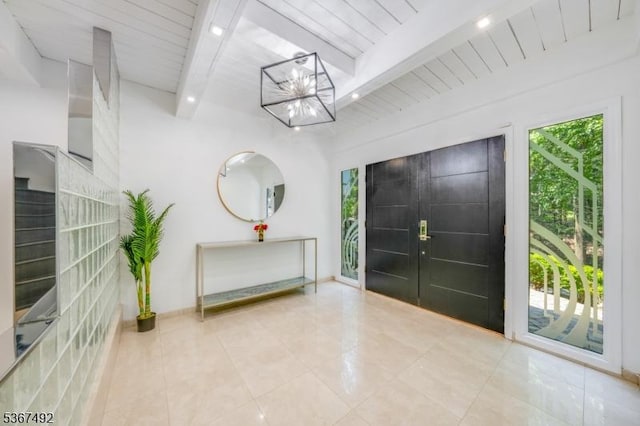 17 Glenwood Rd, Colts Neck Twp, NJ 07722 - foyer entrance featuring beamed ceiling, a chandelier, and tile patterned floors