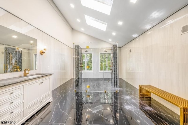 17 Glenwood Rd, Colts Neck Twp, NJ 07722 - bathroom with a skylight, vaulted ceiling, vanity, a marble finish shower, and recessed lighting