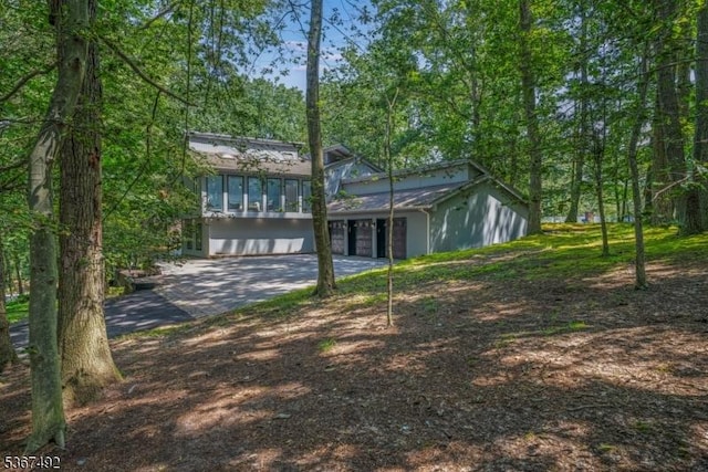 17 Glenwood Rd, Colts Neck Twp, NJ 07722 - view of front of property with concrete driveway and an attached garage