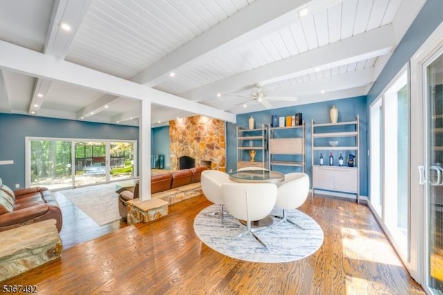 17 Glenwood Rd, Colts Neck Twp, NJ 07722 - living room featuring a fireplace, wood finished floors, beam ceiling, and a ceiling fan