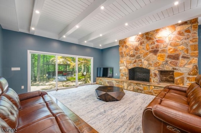 17 Glenwood Rd, Colts Neck Twp, NJ 07722 - living area featuring wood finished floors, beamed ceiling, and a fireplace