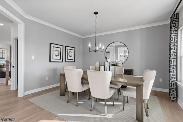 14 Glacier Way, Union Twp, NJ 08867 - dining area with light wood-style flooring, a chandelier, and ornamental molding