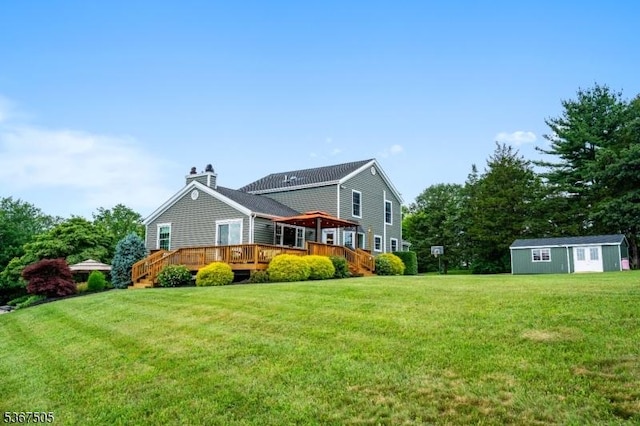 20 Scenic Dr, Fredon Twp, NJ 07860 - rear view of house featuring a yard, a deck, an outbuilding, and a chimney