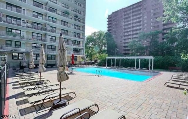 285 Aycrigg Ave Unit 22D, Passaic City, NJ 07055 - community pool featuring a patio area