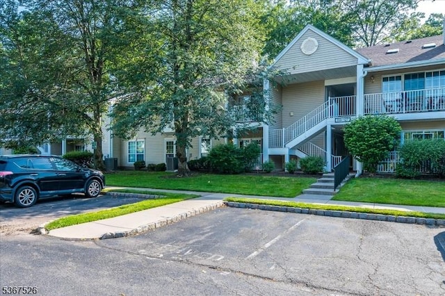 113 Lindsey Ct, Franklin Twp, NJ 08823 - view of building exterior with uncovered parking and stairs
