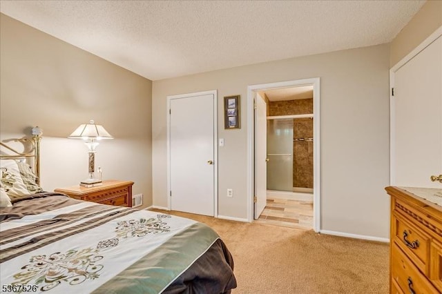 113 Lindsey Ct, Franklin Twp, NJ 08823 - bedroom with light colored carpet, a textured ceiling, and connected bathroom