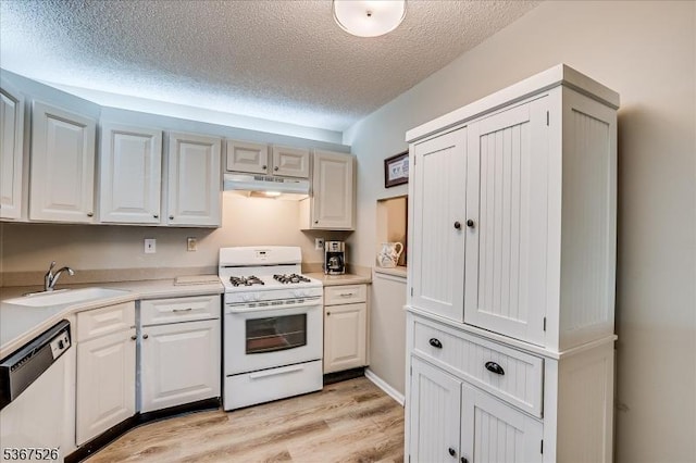 113 Lindsey Ct, Franklin Twp, NJ 08823 - kitchen featuring white gas stove, dishwasher, under cabinet range hood, light countertops, and light wood-style flooring