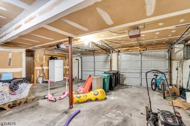 442 Stalevicz Ln, Rahway City, NJ 07065 - garage with freestanding refrigerator and a garage door opener