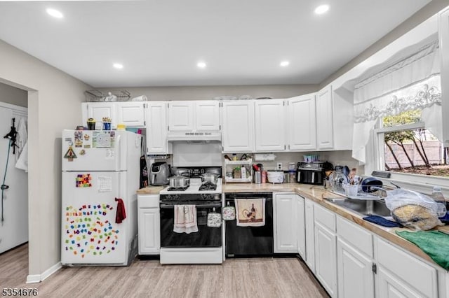 442 Stalevicz Ln, Rahway City, NJ 07065 - kitchen featuring white appliances, under cabinet range hood, light countertops, light wood-style flooring, and white cabinetry