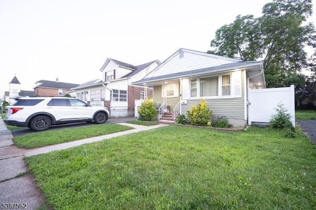 216 S 5th Ave, Manville Boro, NJ 08835 - bungalow-style home featuring a front lawn