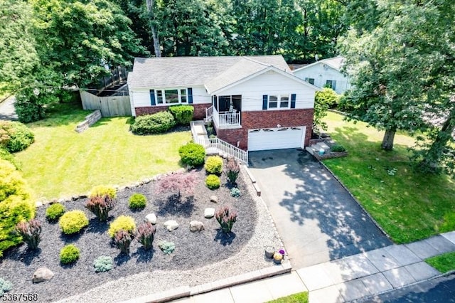 4 Parkway E, Caldwell Boro Twp, NJ 07006 - view of front facade with brick siding, asphalt driveway, an attached garage, and a front lawn