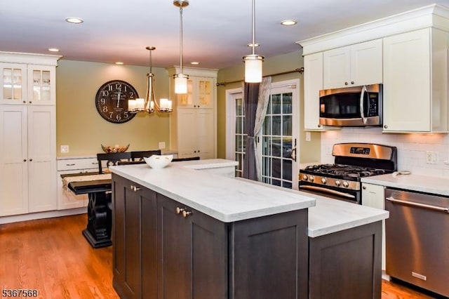4 Parkway E, Caldwell Boro Twp, NJ 07006 - kitchen with appliances with stainless steel finishes, white cabinetry, a center island, glass insert cabinets, and recessed lighting