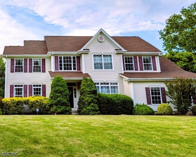 17 Beaver Creek Dr, Raritan Twp, NJ 08822 - view of front facade featuring a front lawn and a shingled roof