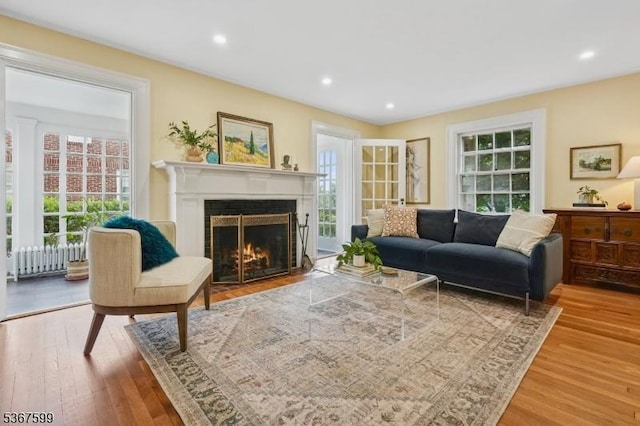 329 W End Rd, South Orange Village Twp, NJ 07079 - living area featuring wood finished floors, radiator, a fireplace with flush hearth, and recessed lighting