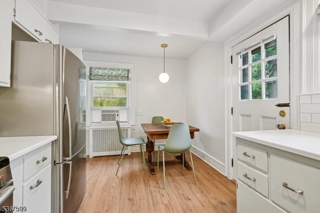 329 W End Rd, South Orange Village Twp, NJ 07079 - dining area with radiator heating unit, plenty of natural light, light wood-style flooring, and cooling unit