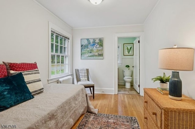 329 W End Rd, South Orange Village Twp, NJ 07079 - bedroom featuring radiator heating unit, light wood-type flooring, crown molding, and connected bathroom