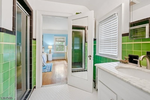 329 W End Rd, South Orange Village Twp, NJ 07079 - bathroom with tile walls, vanity, a shower stall, tile patterned flooring, and wainscoting