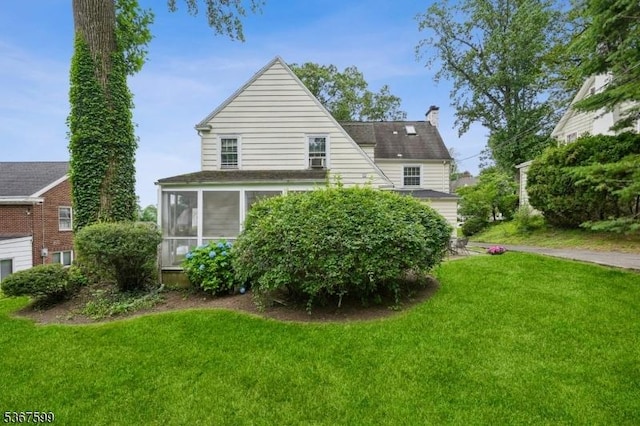 329 W End Rd, South Orange Village Twp, NJ 07079 - back of house featuring a chimney, a sunroom, and a yard