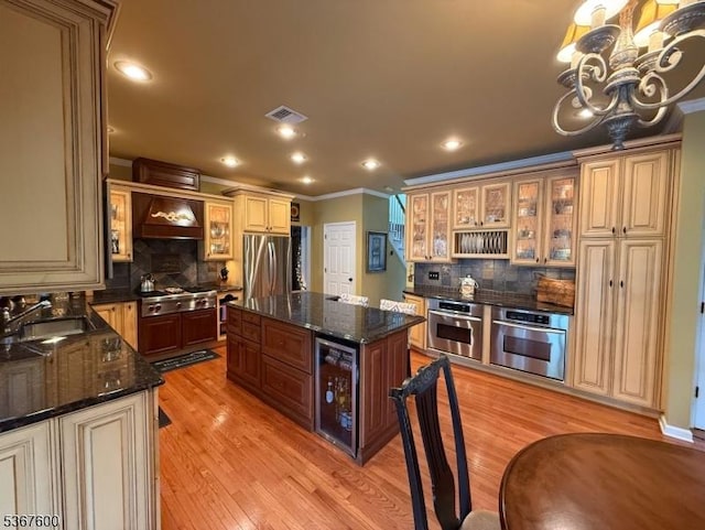 10 Links Ct, Sparta Twp, NJ 07871 - kitchen with appliances with stainless steel finishes, beverage cooler, ornamental molding, backsplash, and a chandelier