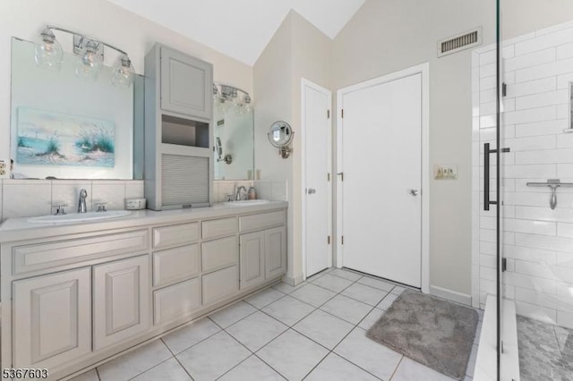 26 Ditmars Cir, Hillsborough Twp, NJ 08844 - bathroom with lofted ceiling, double vanity, tasteful backsplash, a shower stall, and tile patterned flooring
