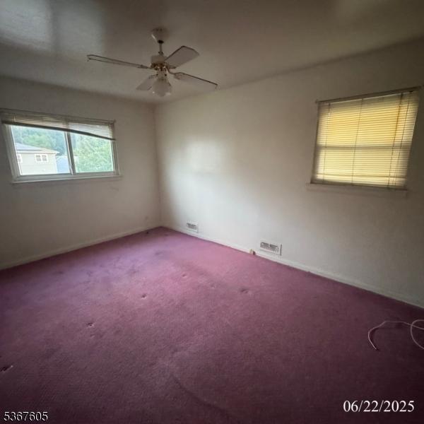 35 Eastern Pkwy, Hillside Twp, NJ 07205 - spare room with carpet flooring and ceiling fan