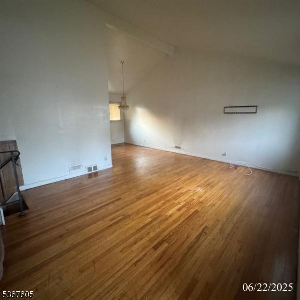 35 Eastern Pkwy, Hillside Twp, NJ 07205 - unfurnished living room with wood finished floors and baseboards