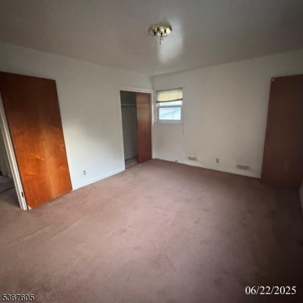 35 Eastern Pkwy, Hillside Twp, NJ 07205 - unfurnished bedroom with light colored carpet and a closet