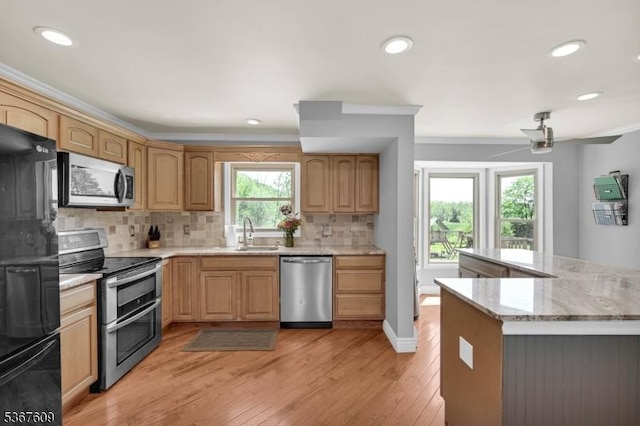1508 County Rd 565, Vernon Twp, NJ 07461 - kitchen with appliances with stainless steel finishes, backsplash, light wood finished floors, recessed lighting, and light stone counters