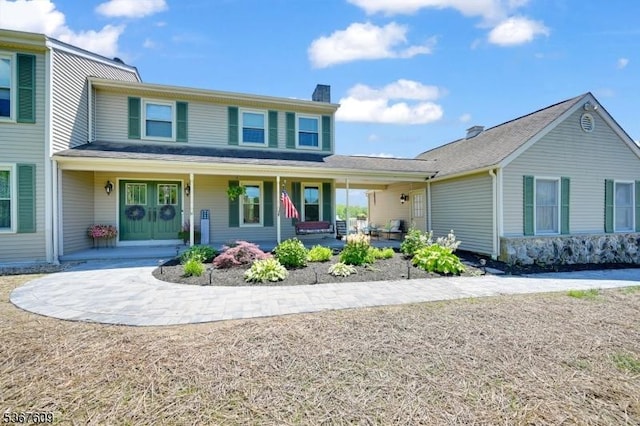 1508 County Rd 565, Vernon Twp, NJ 07461 - view of front of house with a chimney and covered porch