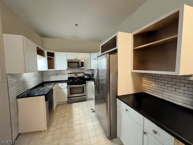 8619 Brittany Dr, Wayne Twp, NJ 07470 - kitchen featuring appliances with stainless steel finishes, open shelves, backsplash, and dark countertops