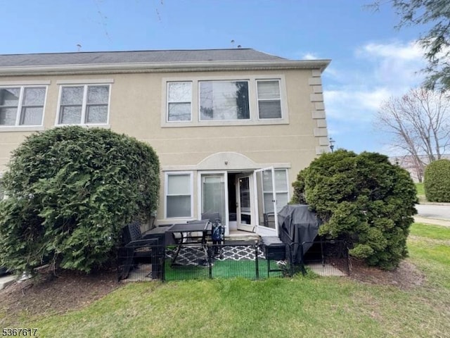 8619 Brittany Dr, Wayne Twp, NJ 07470 - back of property featuring a patio and stucco siding