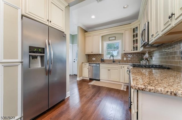 36 E Grant Ave, Roselle Park Boro, NJ 07204 - kitchen with stainless steel appliances, cream cabinetry, dark wood-style flooring, light stone counters, and decorative backsplash