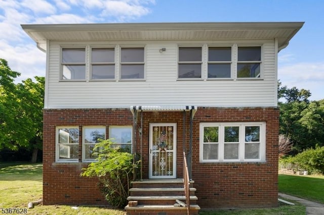 150 Buckley Ave, Oxford Twp, NJ 07863 - view of front of house with brick siding and a front lawn