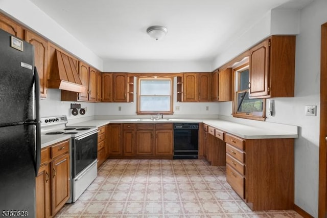 150 Buckley Ave, Oxford Twp, NJ 07863 - kitchen featuring black appliances, brown cabinetry, and light floors