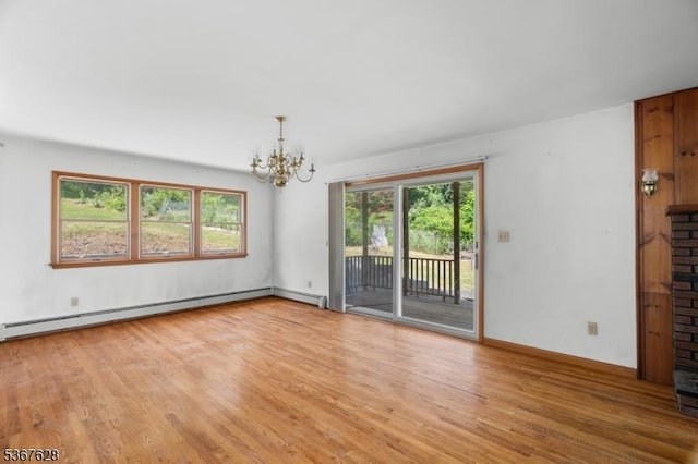 150 Buckley Ave, Oxford Twp, NJ 07863 - unfurnished room featuring a baseboard heating unit, a chandelier, and light wood-style flooring