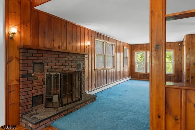 150 Buckley Ave, Oxford Twp, NJ 07863 - unfurnished living room with a baseboard heating unit, a brick fireplace, carpet floors, and wooden walls